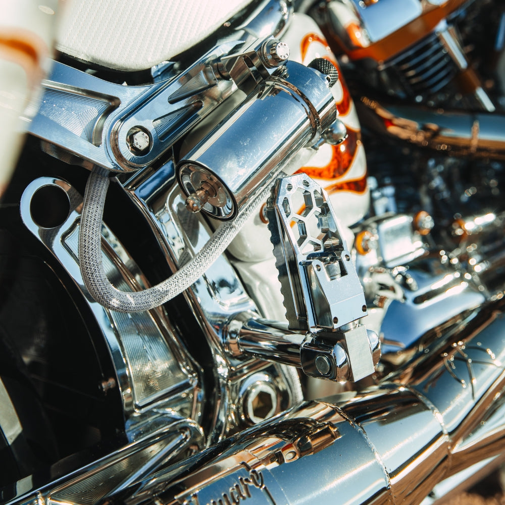 OG HoneyComp V3 Foot Pegs installed on a 2024 Softail Low Rider ST FXLRST